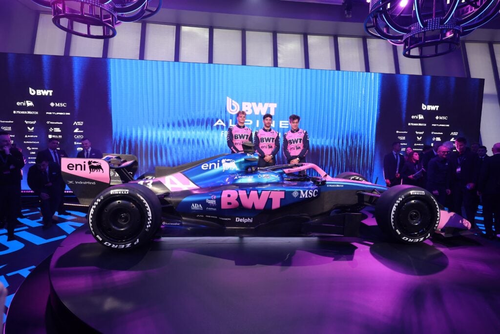 Alpine drivers Pierre Gasly and Franco Colapinto pose with reserve Paul Aron at the launch of the 2026 Alpine F1 livery