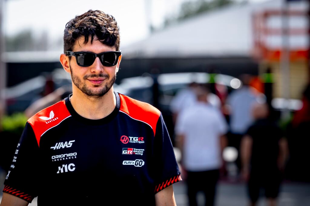 Esteban Ocon of Haas walks in the Bahrain F1 testing paddock