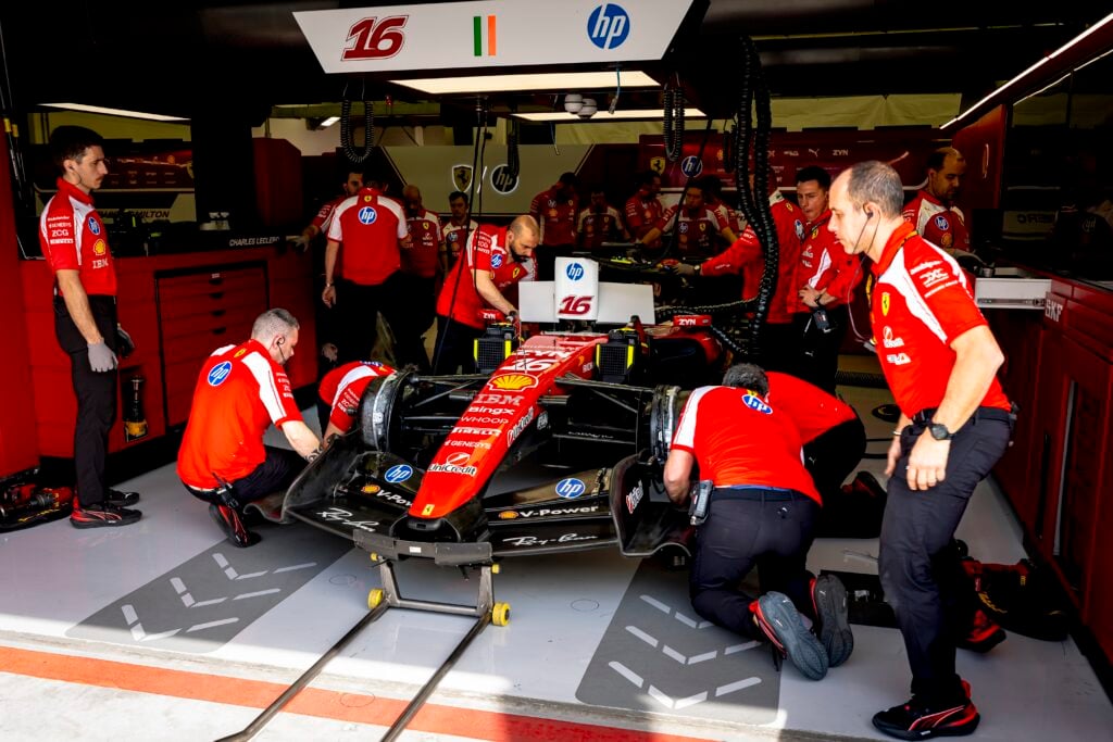 Ferrari work on Charles Leclerc's car in the garage during the 2026 F1 Bahrain test