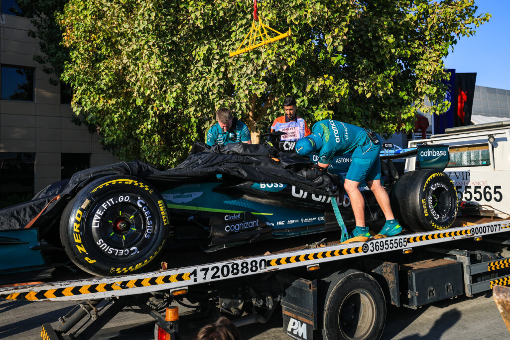 Aston Martin's car on the back of a truck during 2026 Bahrain pre-season testing