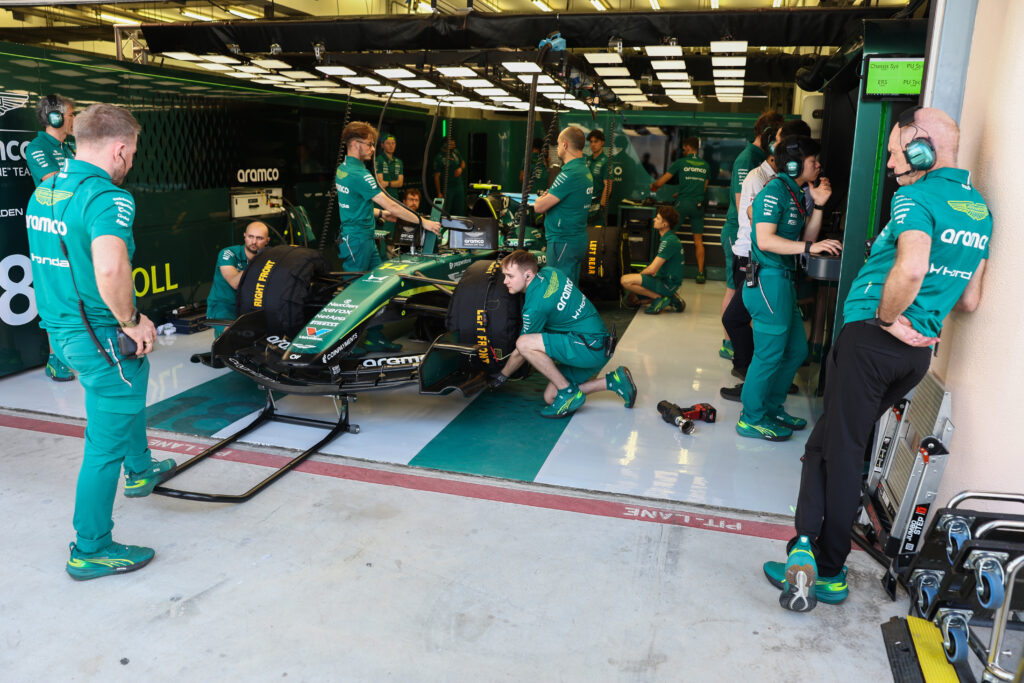 Adrian Newey looks into the Aston Martin garage during the 2026 F1 Bahrain pre-season test