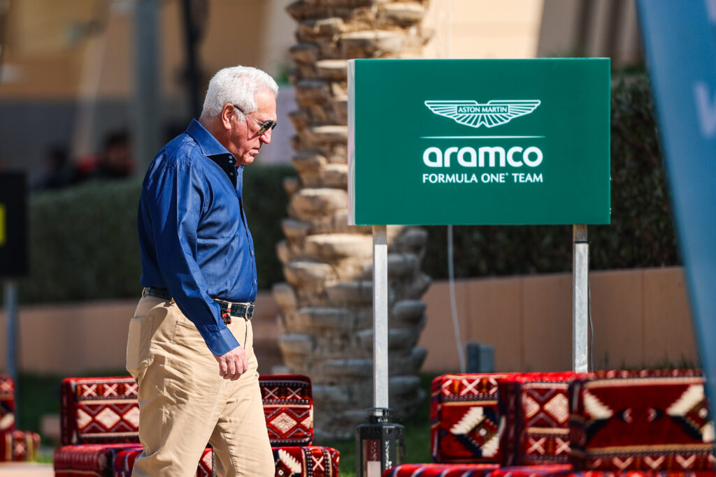 Lawrence Stroll walking part an Aston Martin sign at Formula 1 Testing in Bahrain - Day 3