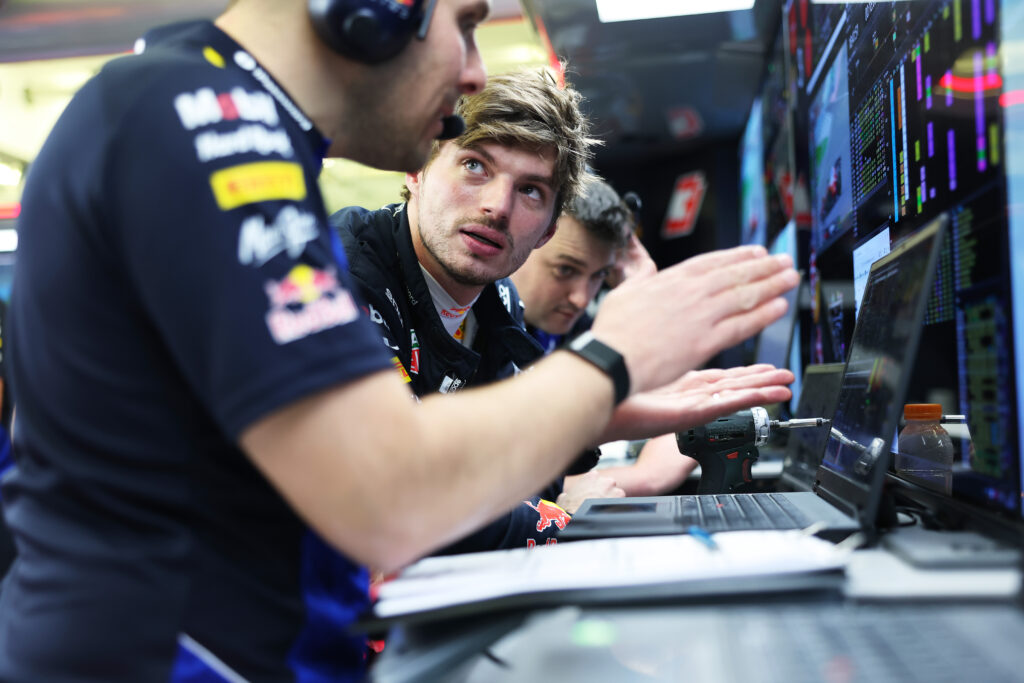 Red Bull driver Max Verstappen speaks to an engineer in the garage during the 2026 F1 Bahrain pre-season test