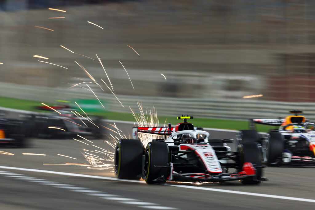 Sparks fly behind Oliver Bearman of Great Britain driving the (87) Haas F1 VF-26 Ferrari on track during day three of F1 Testing at Bahrain International Circuit on February 20, 2026 in Bahrain, Bahrain.