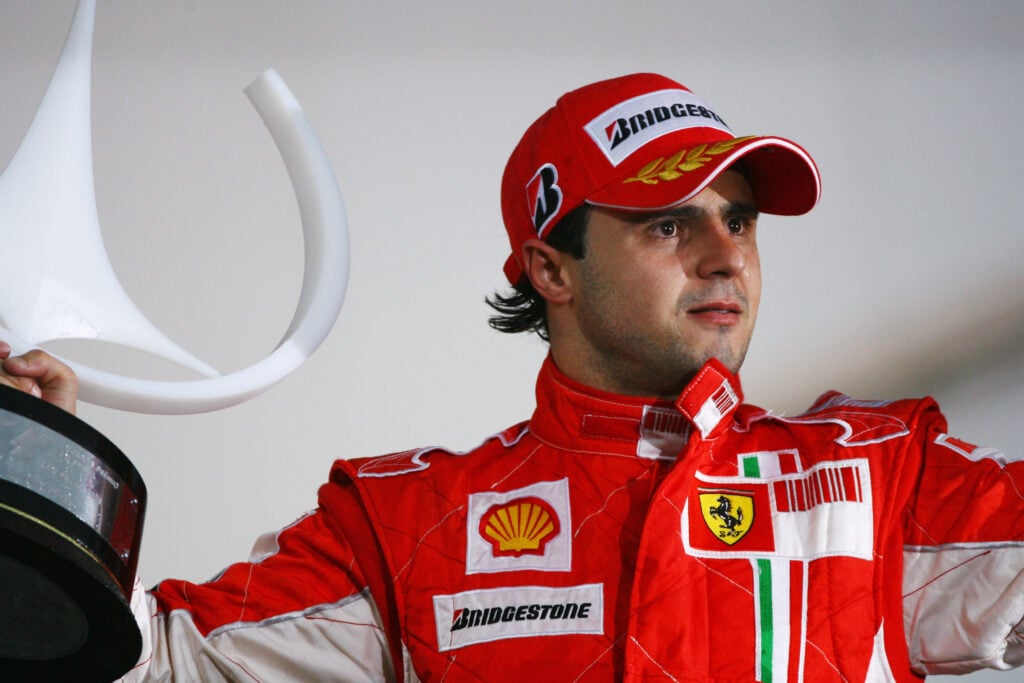 Ferrari driver Felipe Massa celebrates winning the 2008 Brazilian Grand Prix