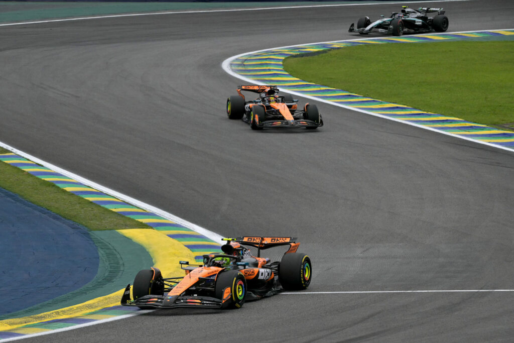 McLaren's British driver Lando Norris (Bottom) races in the lead ahead of McLaren's Australian driver Oscar Piastri and Mercedes' Italian driver Kimi Antonelli during the Sao Paulo Formula One Grand Prix at the Jose Carlos Pace racetrack, aka Interlagos, in Sao Paulo, Brazil on November 9, 2025.