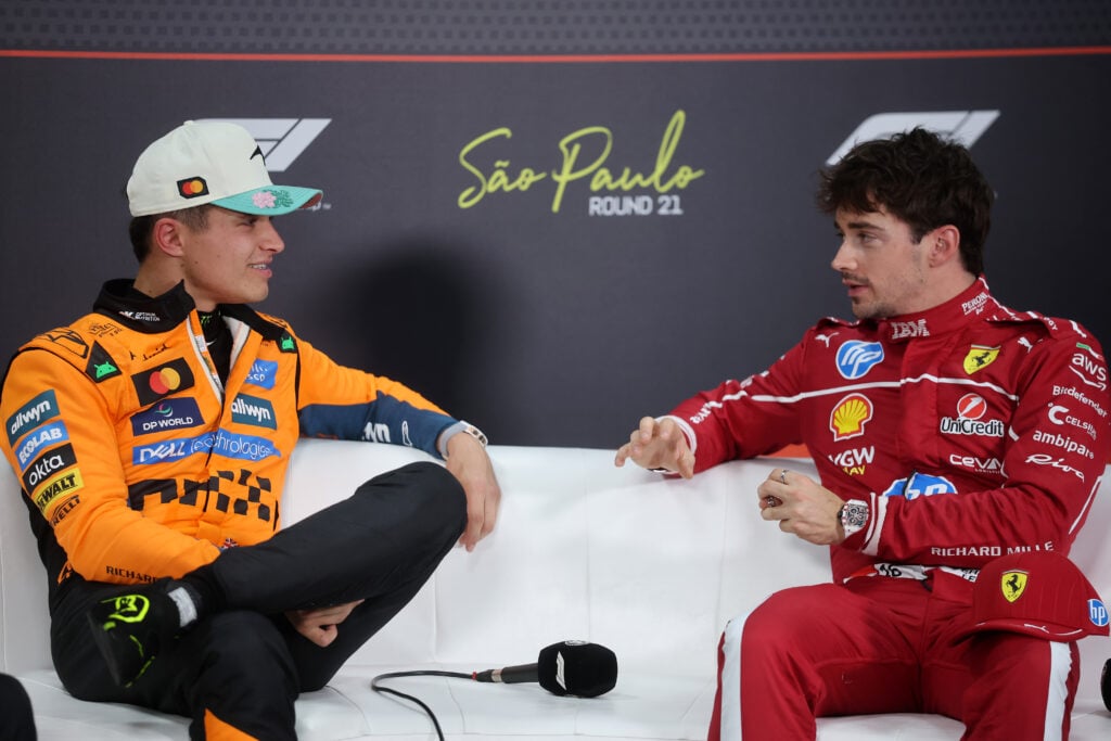 Pole position qualifier Lando Norris of Great Britain and McLaren and Third placed qualifier Charles Leclerc of Monaco and Scuderia Ferrari talk in the Drivers Press Conference during qualifying ahead of the F1 Grand Prix of Brazil at Autodromo Jose Carlos Pace on November 08, 2025 in Sao Paulo, Brazil.