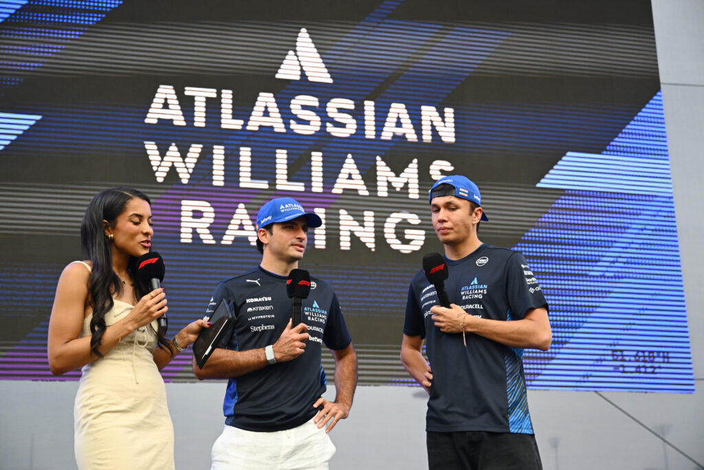 Carlos Sainz of Spain and Williams and Alexander Albon of Thailand and Williams on stage prior to practice ahead of the F1 Grand Prix of Abu Dhabi at Yas Marina Circuit on December 05, 2025 in Abu Dhabi, United Arab Emirates.