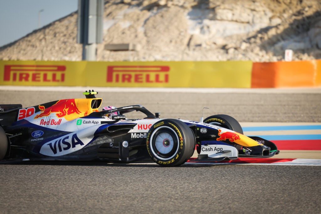 A shot of Liam Lawson on track during the 2026 F1 Bahrain pre-season test showing Racing Bulls' bargeboard concept