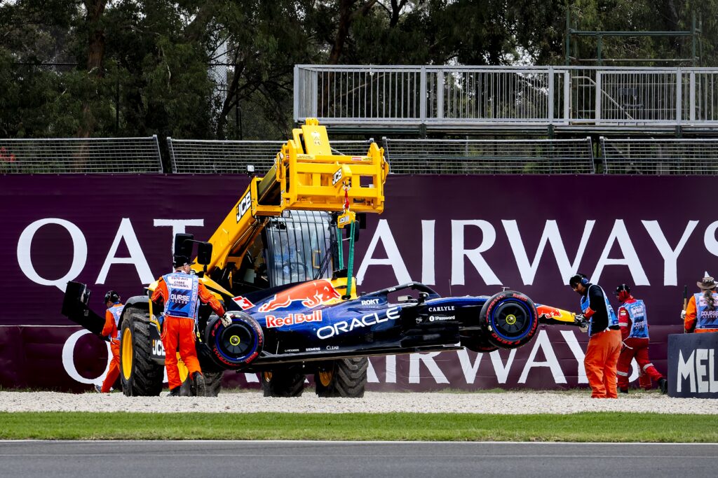 Red Bull driver Max Verstappen's car being lifted off the circuit after crashing during qualifying at the 2026 Australian Grand Prix