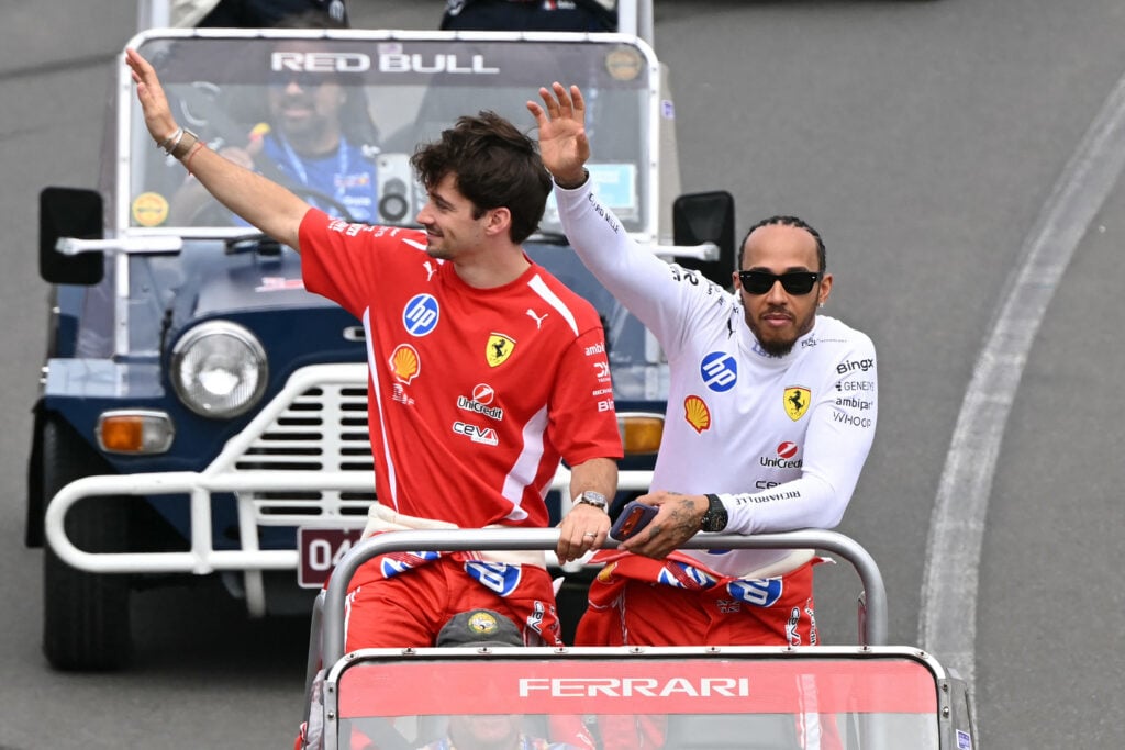 Ferrari's Monegasque driver Charles Leclerc (L) and Ferrari's British driver Lewis Hamilton wave during the drivers' parade ahead of the Formula One Australian Grand Prix at the Albert Park Circuit in Melbourne on March 8, 2026.