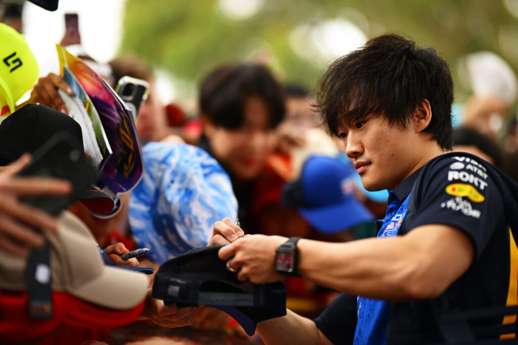 Yuki Tsunoda of Japan and Oracle Red Bull Racing signs autographs for fans on the Melbourne Walk prior to practice ahead of the F1 Grand Prix of Australia at Albert Park Grand Prix Circuit on March 06, 2026 in Melbourne, Australia.