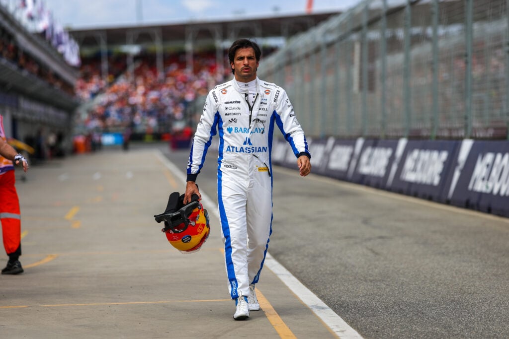 Williams driver Carlos Sainz walking down the pit lane at the 2026 Australian Grand Prix