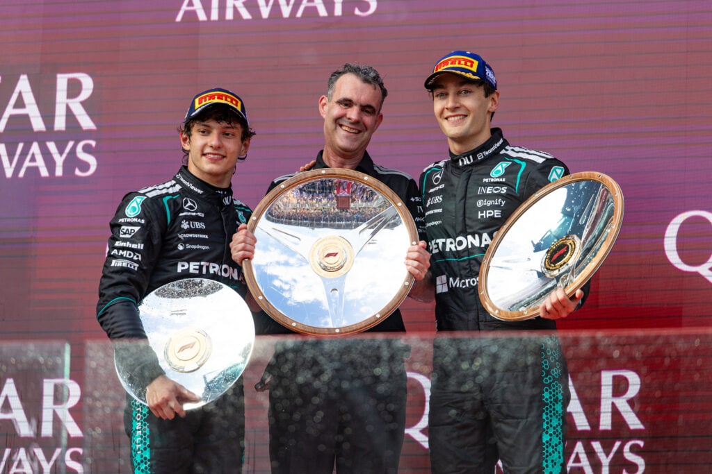 Mercedes drivers Andrea Kimi Antonelli and George Russell celebrate on the podium after their one-two in the 2026 F1 Australian Grand Prix