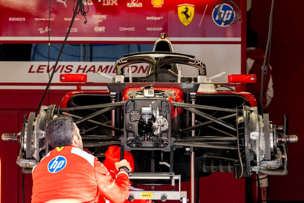 In Shanghai, China, on March 12, 2025, mechanics work on the car of Formula 1 driver Lewis Hamilton of Scuderia Ferrari HP during the Formula 1 China Shanghai media day at the Shanghai International Circuit.