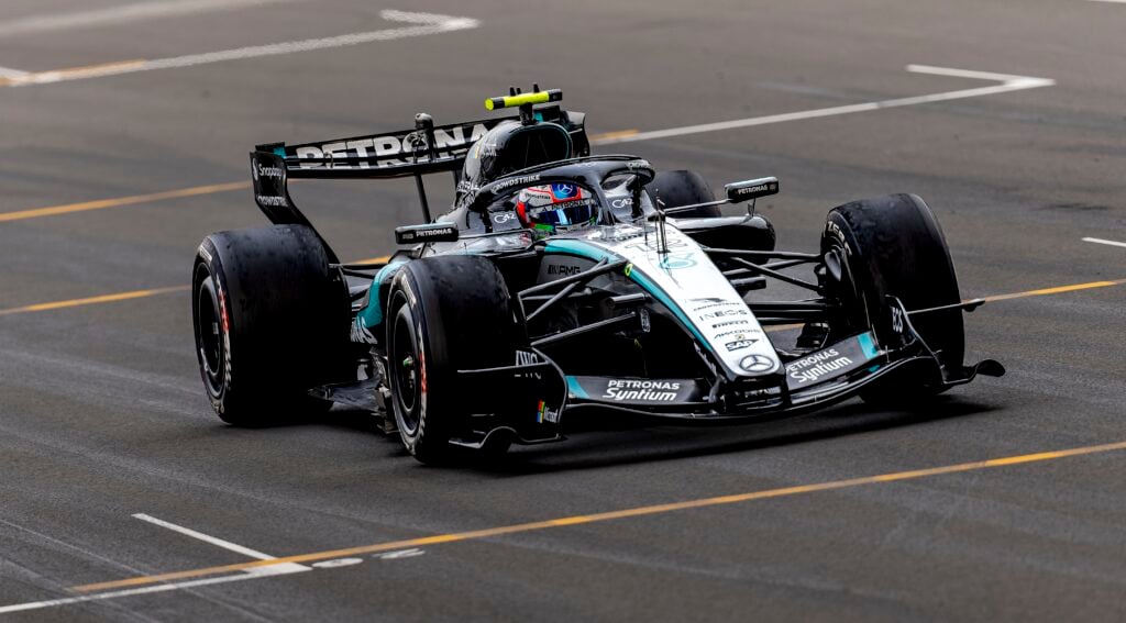 Kimi Antonelli crossing the finish line at the 2026 Chinese Grand Prix in his Mercedes W17 F1 car.