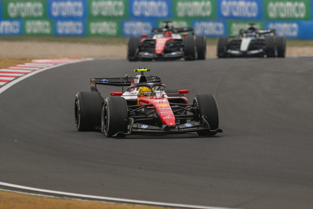 Lewis Hamilton of Scuderia Ferrari HP leads Charles Leclerc and George Russell of Mercedes-AMG Petronas Formula One Team during the 2026 Chinese Grand Prix, at the Shanghai International Circuit, in Shanghai, China, on March 15, 2026.