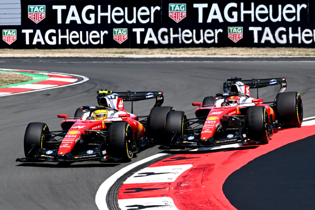 Ferrari driver Charles Leclerc overtakes teammate Lewis Hamilton during the F1 Sprint at the 2026 Chinese Grand Prix