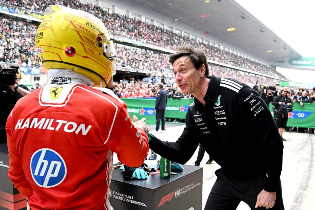 Toto Wolff, Executive Director of Mercedes AMG Petronas F1 Team congratulates Third placed Lewis Hamilton of Great Britain and Scuderia Ferrari in parc ferme during the F1 Grand Prix of China at Shanghai International Circuit on March 15, 2026 in Shanghai, China.