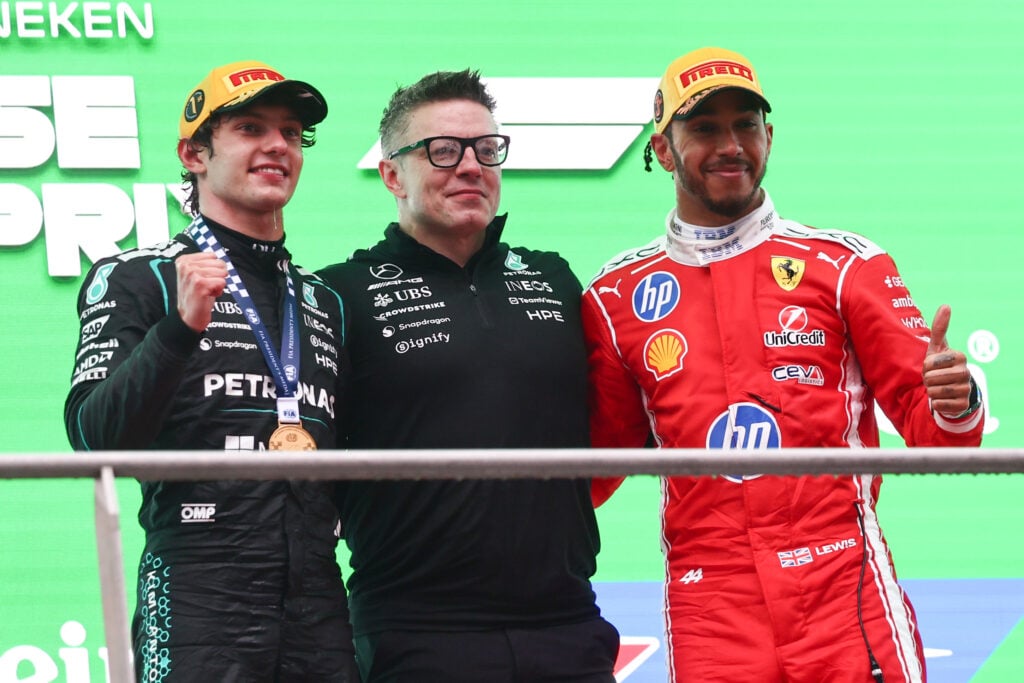 Kimi Antonelli, Peter Bonnington and Lewis Hamilton on the podium at the Chinese Grand Prix