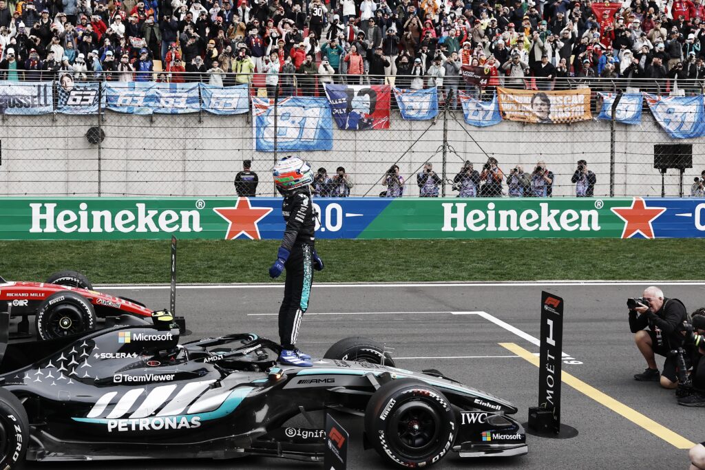 Mercedes driver Andrea Kimi Antonelli celebrates winning the 2026 F1 Chinese Grand Prix on the grid after the race