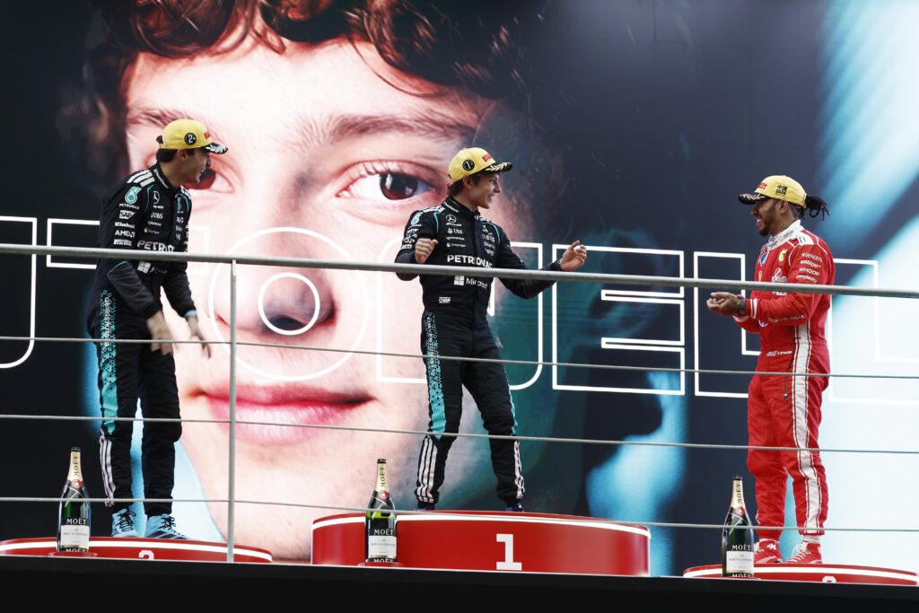 Race winner Andrea Kimi Antonelli of Italy and Mercedes AMG Petronas Formula 1 Team, Second placed George Russell of Great Britain and Mercedes AMG Petronas Formula 1 Team, Third placed Lewis Hamilton of Great Britain and Scuderia Ferrari and Peter Bonnington on the podium during the Formula 1 Grand Prix of China at Shanghai International Circuit on March 15, 2026 in Shanghai, China.