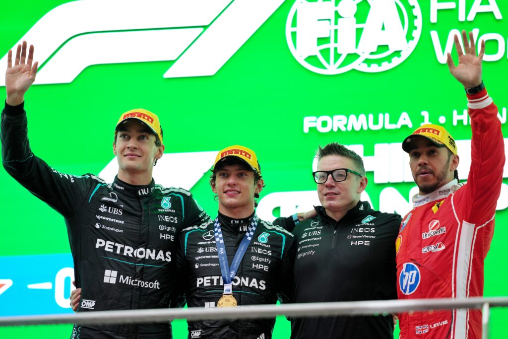 Race winner Andrea Kimi Antonelli of Italy and Mercedes AMG Petronas Formula 1 Team, Second placed George Russell of Great Britain and Mercedes AMG Petronas Formula 1 Team, Third placed Lewis Hamilton of Great Britain and Scuderia Ferrari and Peter Bonnington, Race Engineer of Mercedes AMG Petronas Formula 1 Team on the podium during the Formula 1 Grand Prix of China at Shanghai International Circuit on March 15, 2026 in Shanghai, China.