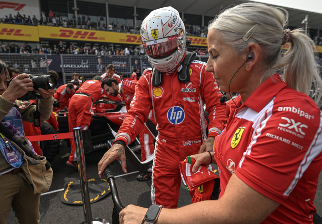 Lewis Hamilton of Mercedes-AMG Petronas F1 Team steps out of his car for a brief break on the grid ahead of the 2026 Japanese Grand Prix at Suzuka Circuit in Suzuka, Mie Prefecture, Japan, on March 29, 2026.