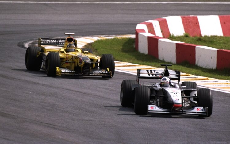 29 Mar 1998:  McLaren Mercedes driver David Coulthard of Scotland laps former Williams team mate Damon Hill in his Jordan during the Brazilian Gran...