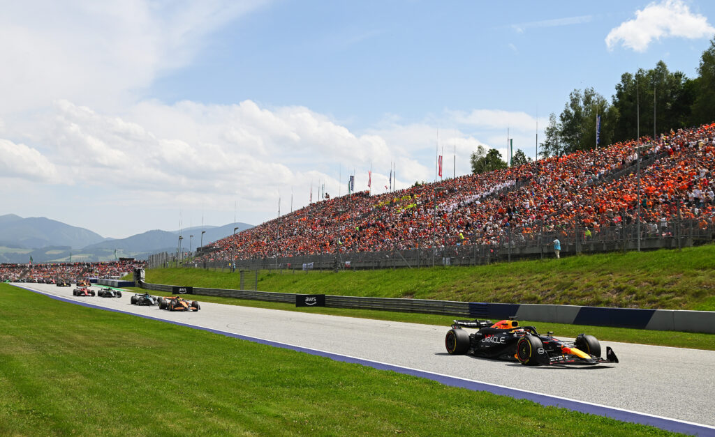 Red Bull driver Max Verstappen leads Lando Norris of McLaren on track during the 2024 F1 Austrian Grand Prix