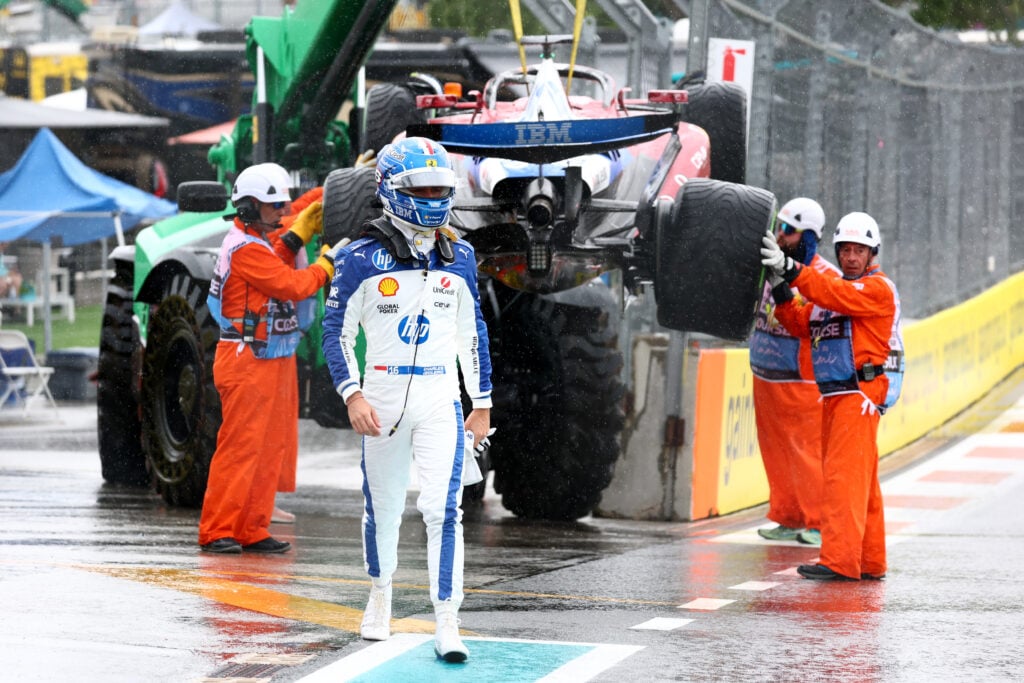 Marshals remove the car of Charles Leclerc of Monaco driving the (16) Scuderia Ferrari SF-25 from the circuit after a crash on the way to the grid during the Sprint ahead of the F1 Grand Prix of Miami at Miami International Autodrome on May 03, 2025 in Miami, Florida.