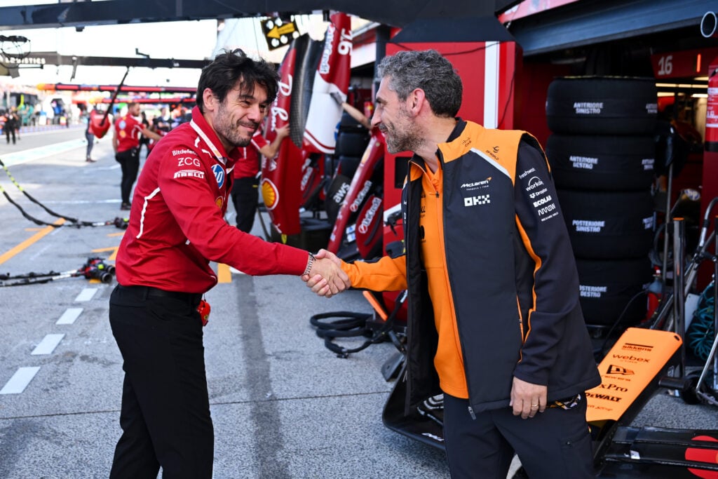 McLaren team principal Andrea Stella shakes hands with a former Ferrari colleague in the pit lane during final practice ahead of the 2025 F1 Dutch Grand Prix