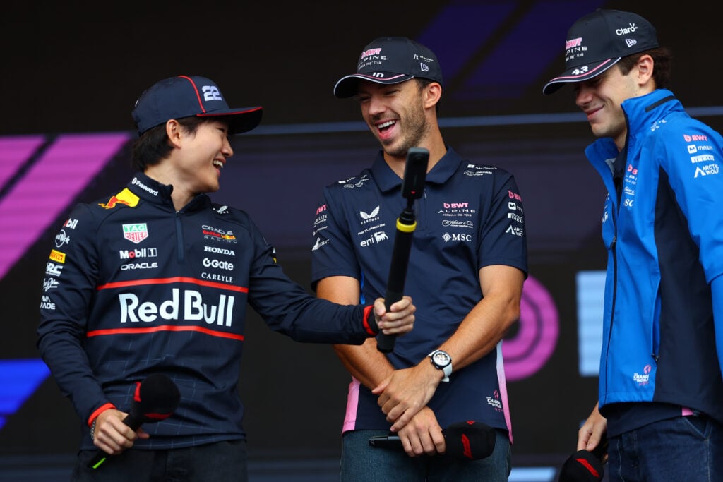Yuki Tsunoda of Japan and Oracle Red Bull Racing Pierre Gasly of France and Alpine F1 and Franco Colapinto of Argentina and Alpine F1 on stage prior to final practice ahead of the F1 Grand Prix of Azerbaijan at Baku City Circuit on September 20, 2025 in Baku, Azerbaijan.