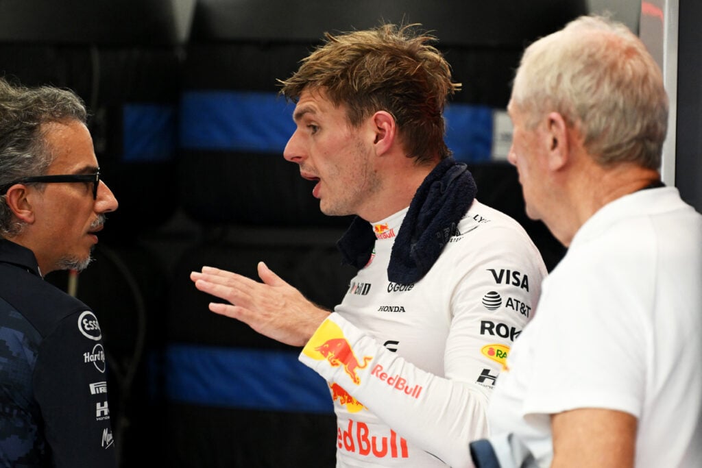 Laurent Mekies, Team Principal of Oracle Red Bull Racing Max Verstappen of the Netherlands and Oracle Red Bull Racing and Dr Helmut Marko, Team Consultant of Oracle Red Bull Racing talk in the garage during practice ahead of the F1 Grand Prix of Singapore at Marina Bay Street Circuit on October 03, 2025 in Singapore, Singapore.