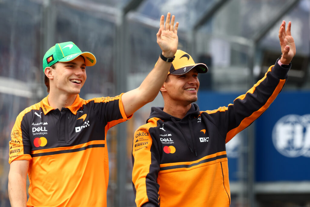 Oscar Piastri of Australia and McLaren and Lando Norris of Great Britain and McLaren wave on the drivers parade prior to the F1 Grand Prix of Australia at Albert Park Grand Prix Circuit on March 08, 2026 in Melbourne, Australia.
