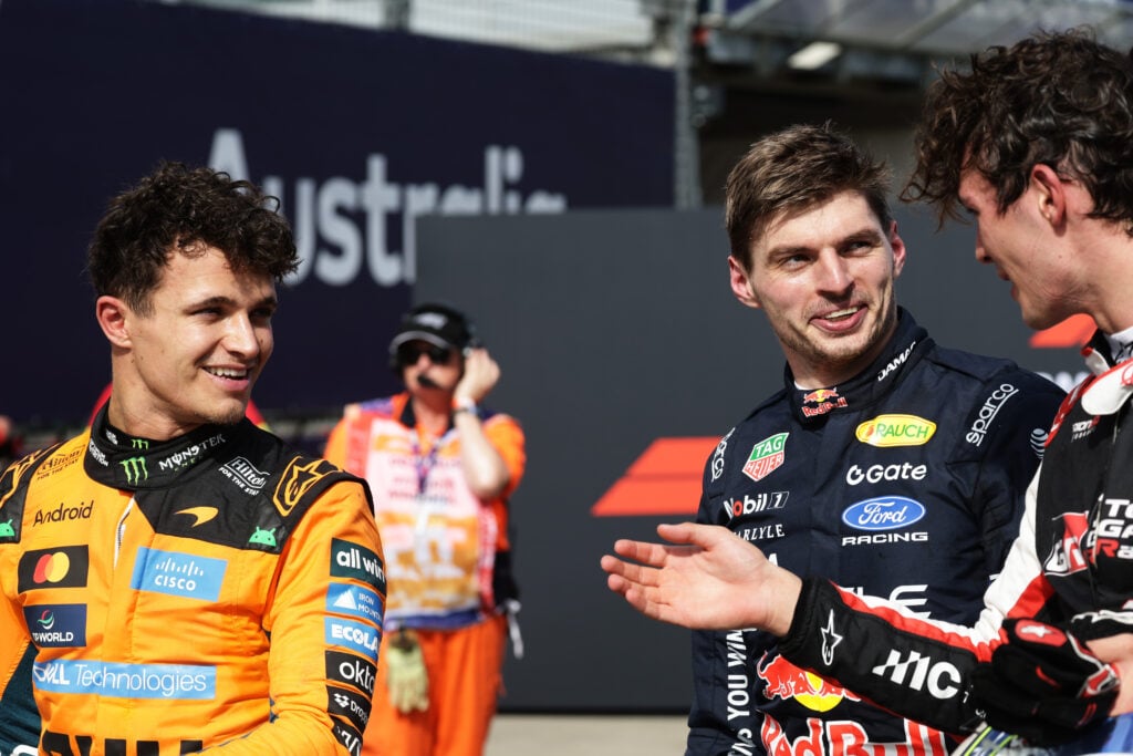 McLaren's Lando Norris speaks with Red Bull's Max Verstappen and Haas' Oliver Bearman before the 2026 F1 Australian Grand Prix