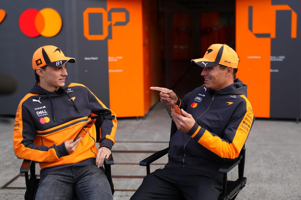 Oscar Piastri of Australia and McLaren and Lando Norris of Great Britain and McLaren talk in the Paddock during previews ahead of the F1 Grand Prix of China at Shanghai International Circuit on March 12, 2026 in Shanghai, China.