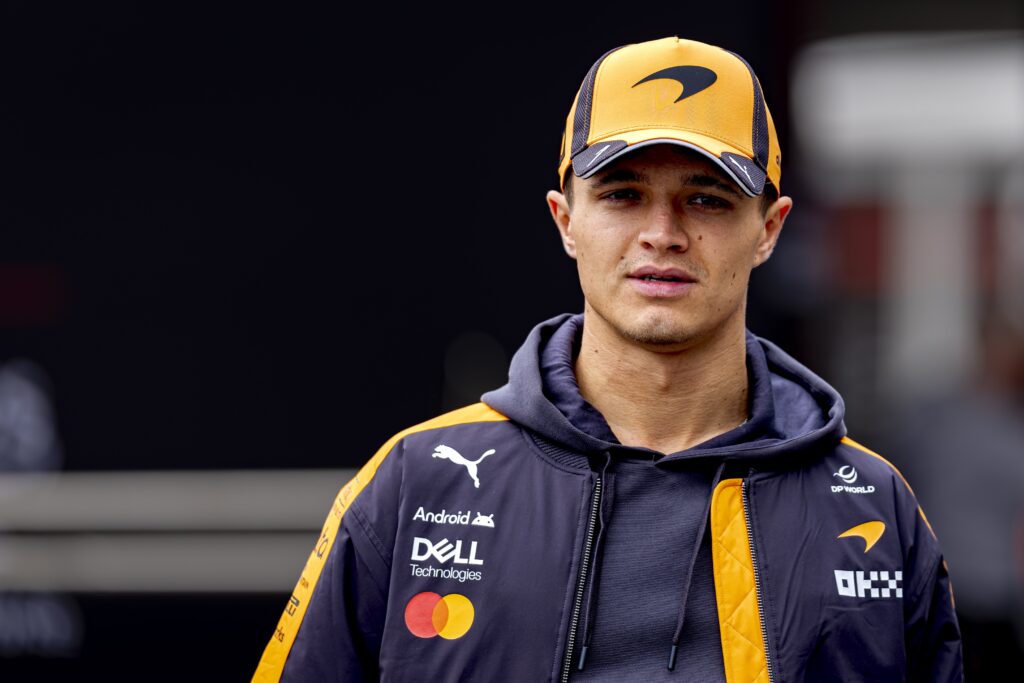 Lando Norris of McLaren walks in the F1 paddock