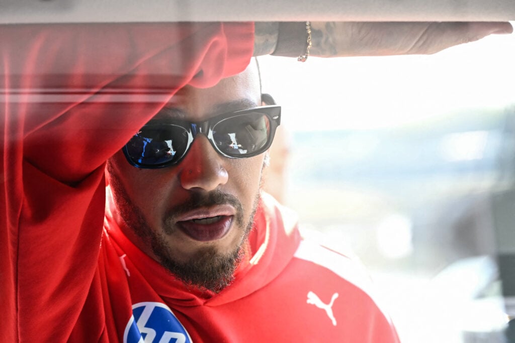 Ferrari's British driver Lewis Hamilton looks on before the first practice session of the Formula One Japanese Grand Prix in Suzuka on March 27, 2026.