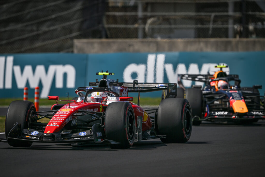 Ferrari's Charles Leclerc leads Red Bull driver Max Verstappen on track during practice at the 2026 F1 Japanese Grand Prix