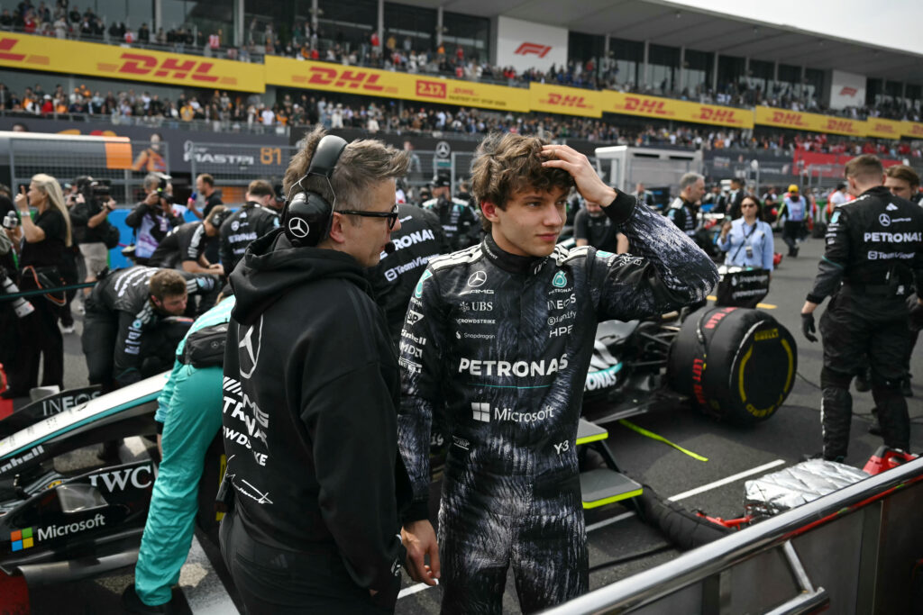 Mercedes' Italian driver Kimi Antonelli (R), who is in pole position, gestures before the start of the Formula One Japanese Grand Prix at the Suzuka circuit in Suzuka, Mie prefecture on March 29, 2026.