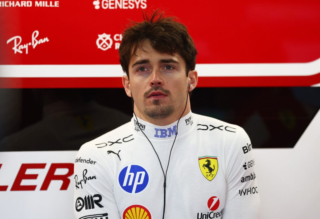 Charles Leclerc stands in the Ferrari garage at the 2026 Japanese Grand Prix