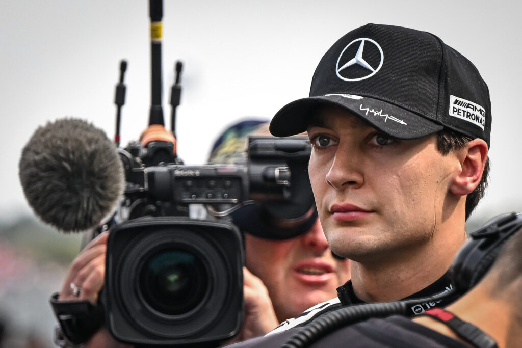George Russell of MercedesAMG Petronas speaks with a team member as he returns to his grid position after the formation lap just minutes before the start of the 2026 Japanese Grand Prix at Suzuka Circuit in Suzuka, Mie Prefecture, Japan, on March 29, 2026.