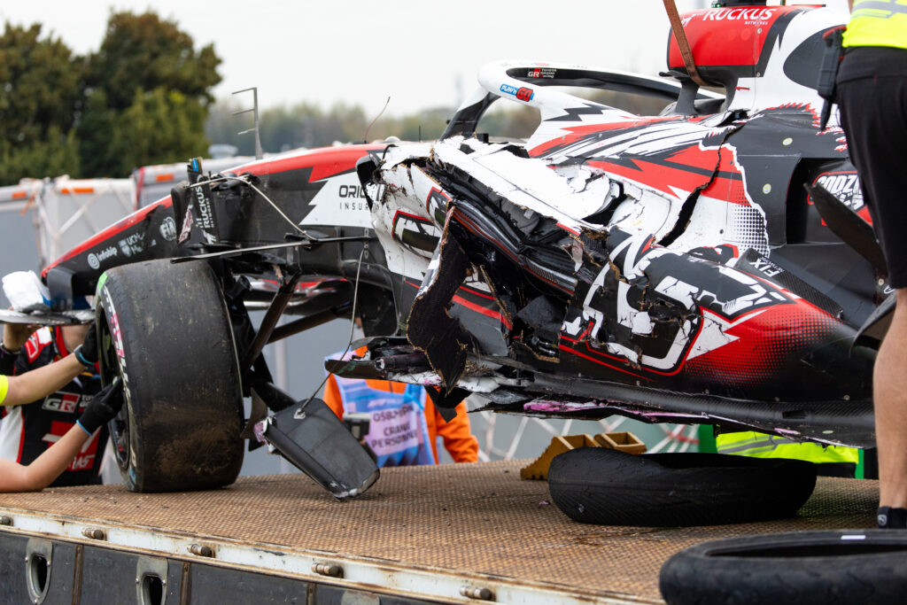 Oliver Bearman's Haas is recovered after his crash during the 2026 F1 Japanese Grand Prix