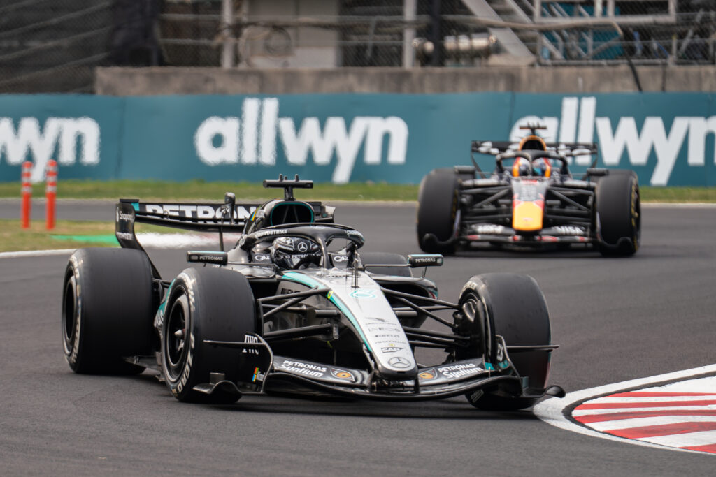 Mercedes' George Russell leads Red Bull driver Max Verstappen on track during the 2026 F1 Japanese Grand Prix