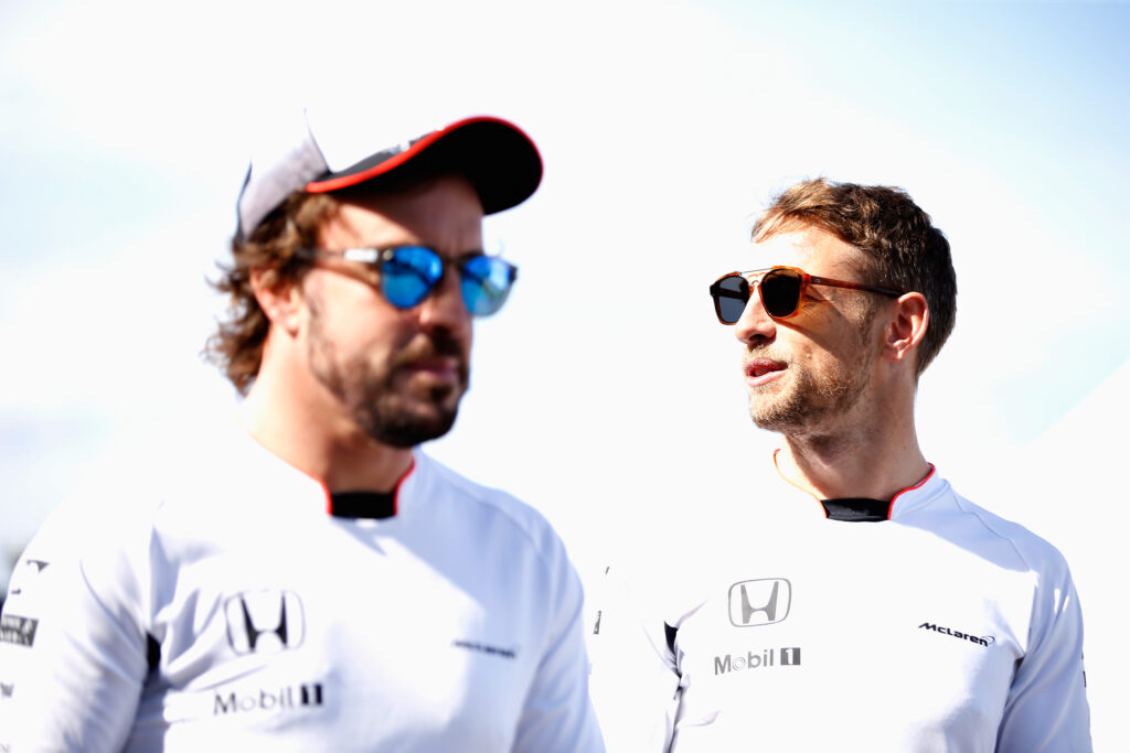 Jenson Button of Great Britain and McLaren Honda and team mate Fernando Alonso of Spain and McLaren Honda in the Paddock during practice for the Canadian Formula One Grand Prix at Circuit Gilles Villeneuve on June 9, 2016 in Montreal, Canada.