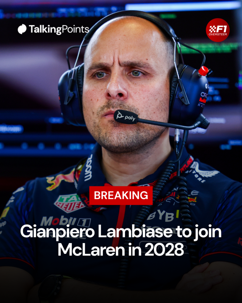 Gianpiero Lambiase stands with his arms crossed whilst in the Red Bull garage