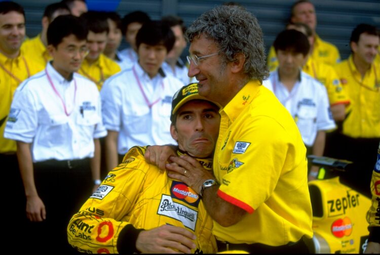 12 Sep 1999:  Eddie Jordan (right) jokingly strangles his Jordan driver Damon Hill, both of Great Britain, during the Italian Formula One Grand Pri...