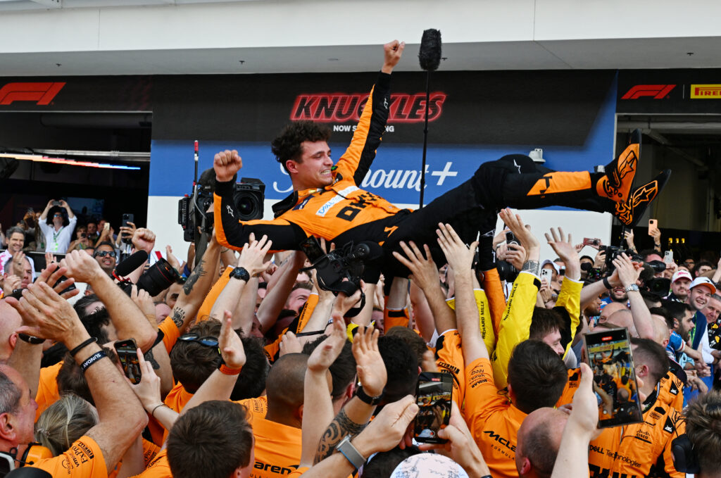 McLaren's British driver Lando Norris is tossed in the air as his team celebrates his victory in the 2024 Miami Formula One Grand Prix at Miami International Autodrome in Miami Gardens, Florida, on May 5, 2024.