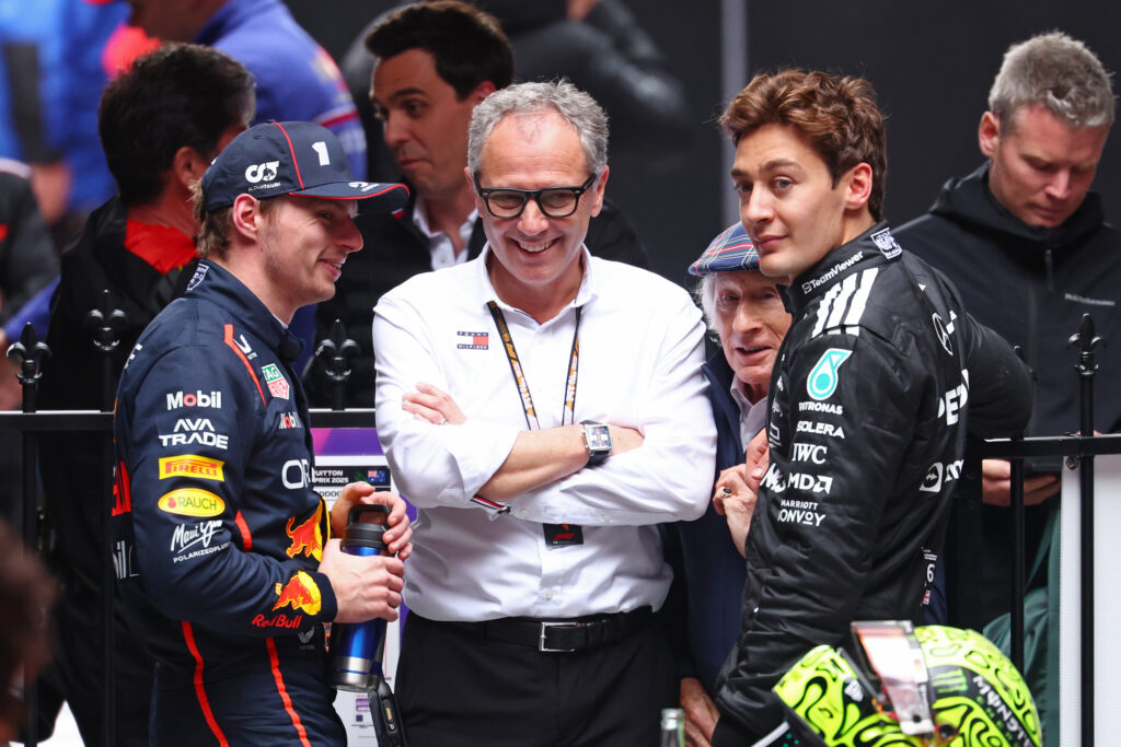 Second placed Max Verstappen of the Netherlands and Oracle Red Bull Racing and Third placed George Russell of Great Britain and Mercedes AMG Petronas F1 Team with Stefano Domenicali, CEO of the Formula One Group in parc ferme during the F1 Grand Prix of Australia at Albert Park Grand Prix Circuit on March 16, 2025 in Melbourne, Australia.